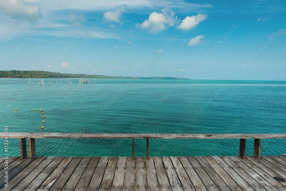 Wooden bridge or wooden deck at the tropical sea at Koh Kood island, Wooden deck for relaxation at Koh Kood Island, Thailand Wooden bridge or wooden deck at the tropical sea at Koh Kood island, Wooden deck for relaxation at Koh Kood Island, Thailand
