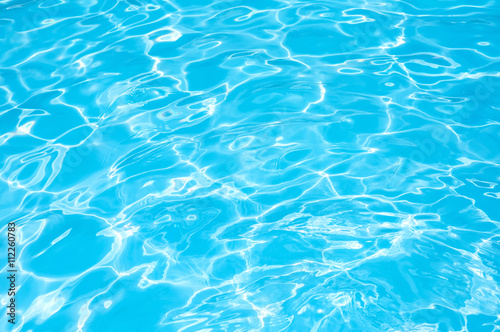 Blue water abstract, Blue water in swimming pool, Ripple water in swimming pool with sun reflection