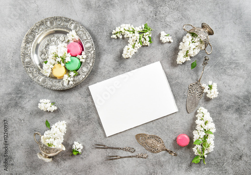 Macarons cokies white paper. Vintage flat lay lilac flowers photo