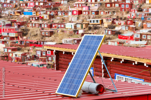 Photography Solar panel on a red roof at Larung gar (Buddhist Academy) in Sichuan, China