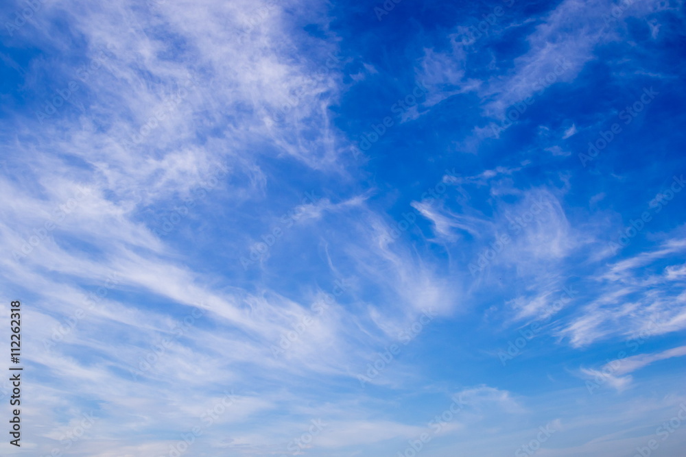 Plumose clouds in the blue sky background