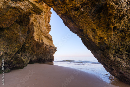 Beautiful natural arch on the beach of Praia da Rocha, Portimao Coast. Algarve region. Portugal © alexanderkonsta