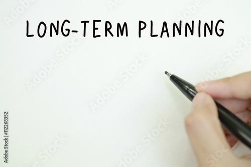 hand writing on paper long term planning concept, business concept