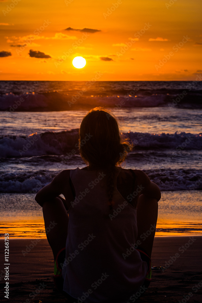 Woman watching sunset 