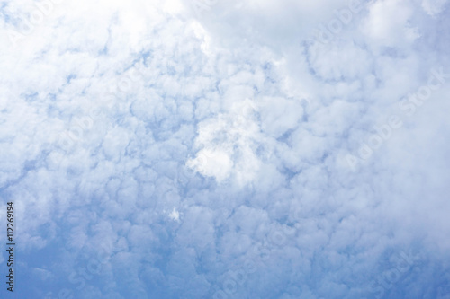 Puffy cloud with deep blue sky