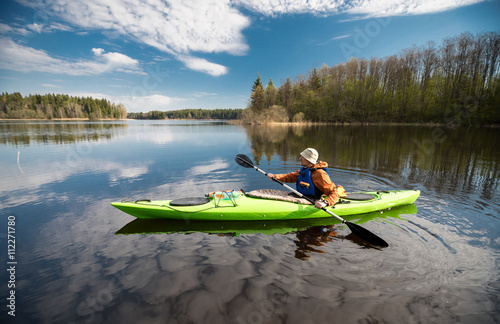 Kayaker on the lake, paddling, active lifestyle