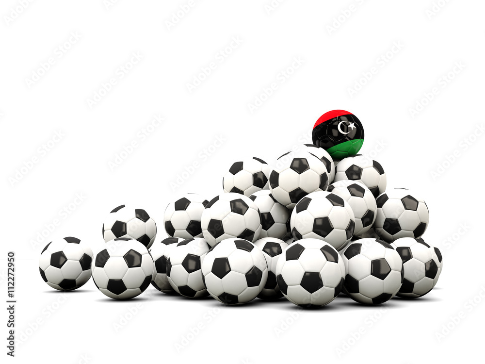 Pile of soccer balls with flag of libya Pile of soccer balls with flag of libya