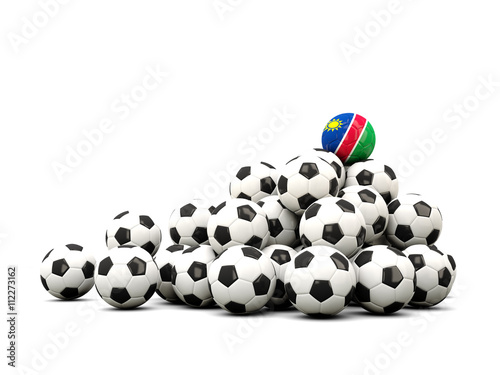 Pile of soccer balls with flag of namibia