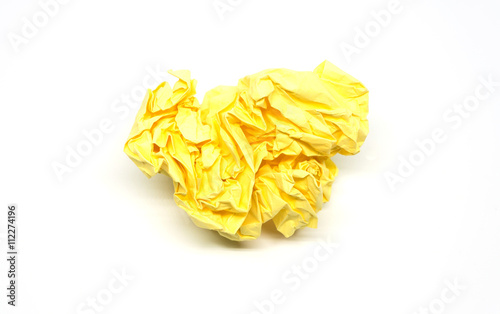 Crumpled yellow paper ball isolated on a white background