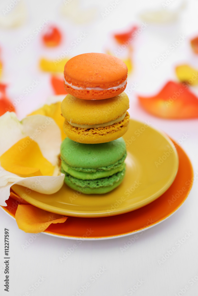 Plate with fresh macaroons on light background Plate with fresh macaroons on light background