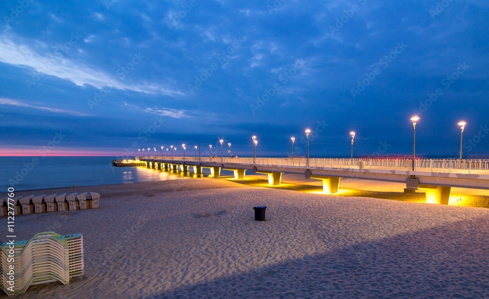 Colorful lights on the pier in the evening, Kolobrzeg, Poland