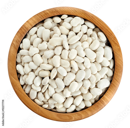 Wooden bowl with beans isolated on white background.
