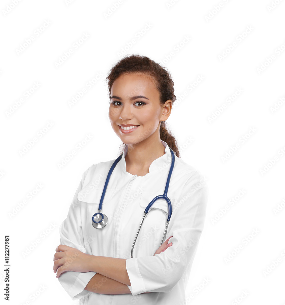 Beautiful African American female doctor on white background