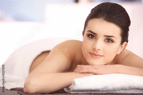 Young woman relaxing in spa center