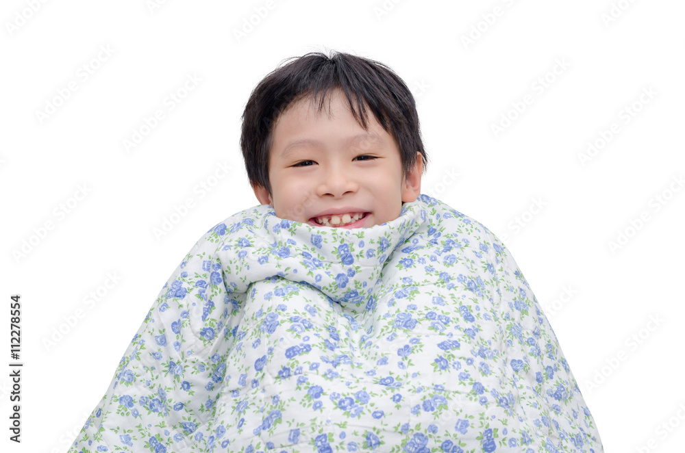 Young asian boy smiling under blanket isolated over white Young asian boy smiling under blanket isolated over white