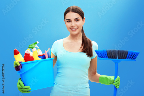 Female cleaner on blue back...
