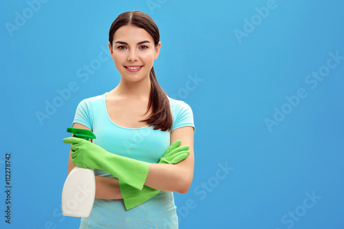 Female cleaner on blue back...