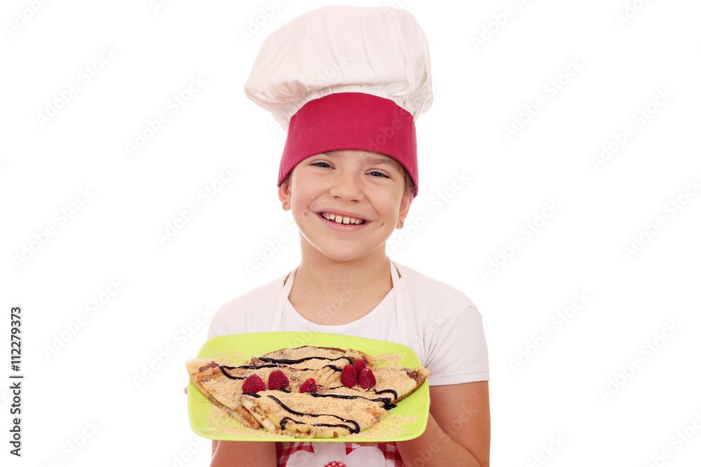 happy little girl cook with sweet crepes