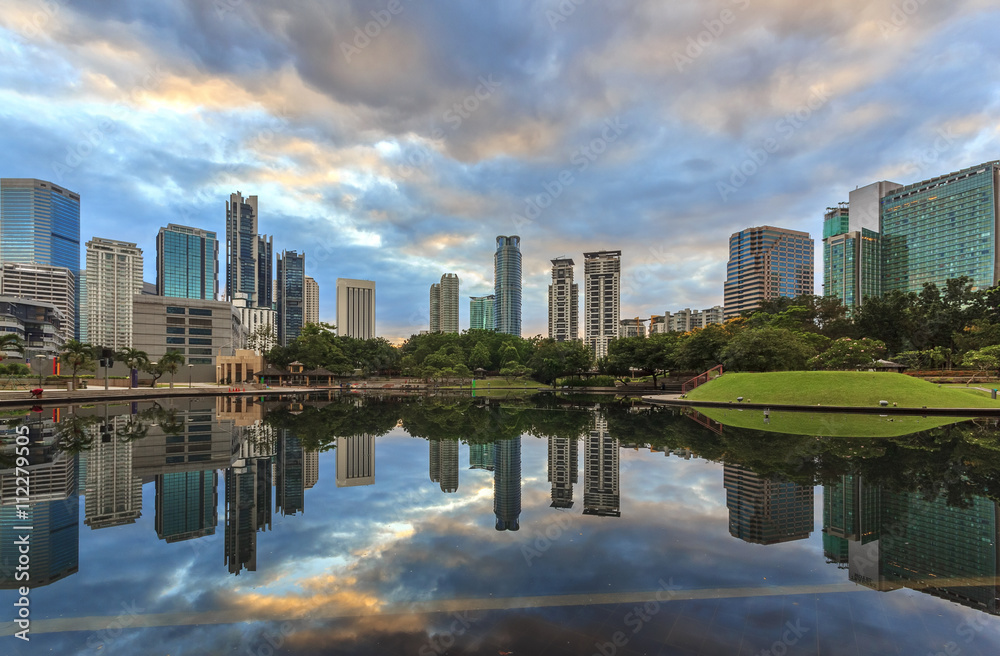 Fototapeta premium Kuala Lumpur city downtown at sunrise with reflection of skyline