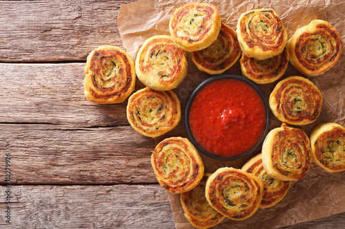 sliced potato rolls with tomato sauce close up. horizontal top view 