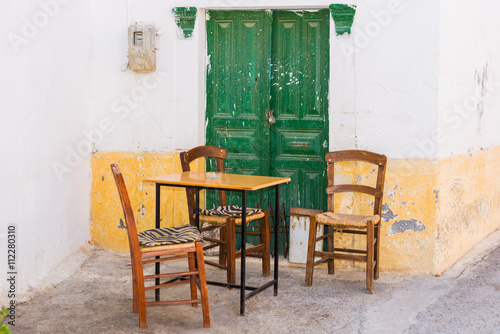 Shady place with table and chairs in the village Pitsidia in the south of Crete. Pitsidia is situated in the south of the Ida mountain range close to Matala. A nice little village and destination © ksl