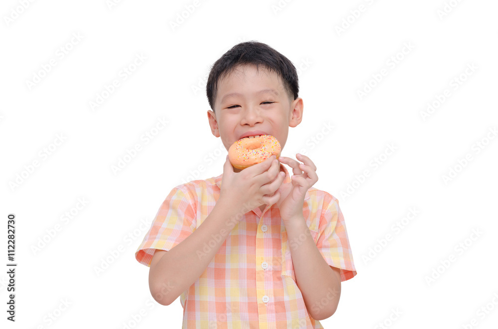 Young Asian boy eating donut over white Young Asian boy eating donut over white