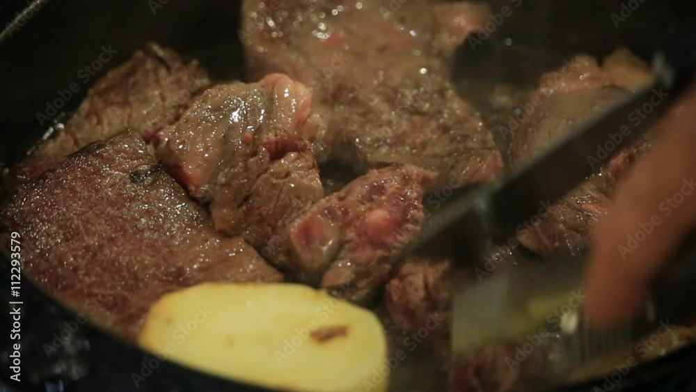 Roasting sliced beef on hot pan Roasting sliced beef on hot pan