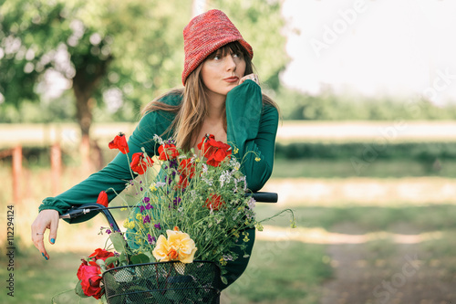 Woman rding bike outdoor in park photo