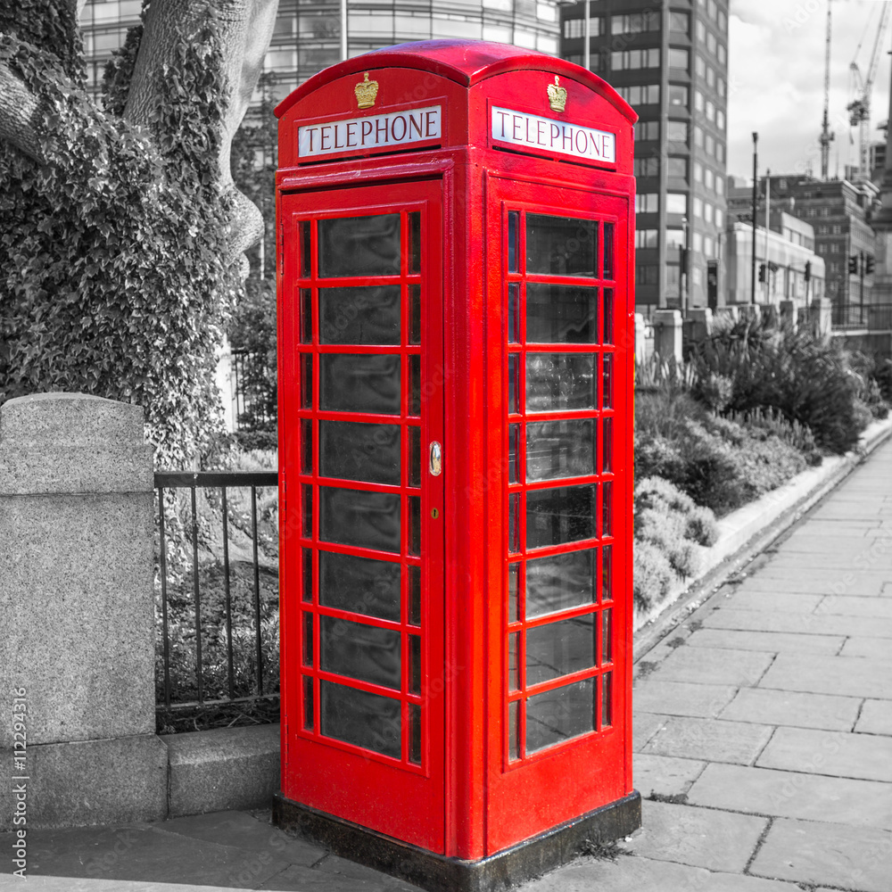 Red telephone booth on the street of London, UK Red telephone booth on the street of London, UK