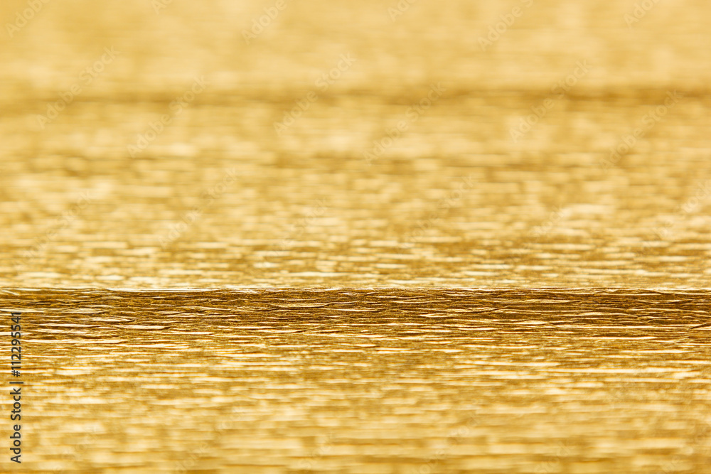 Abstract gold background with blur. The texture.