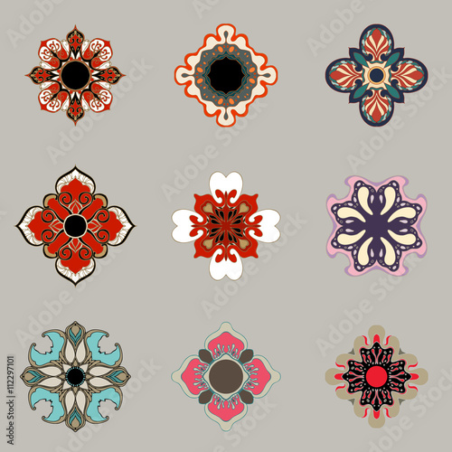 Set of decorative design elements isolated on grey background. Flowers, snowflakes, abstract floral pattern. Vector logo, emblem, sign, stick figures. Floral ornament. Vector graphic design template