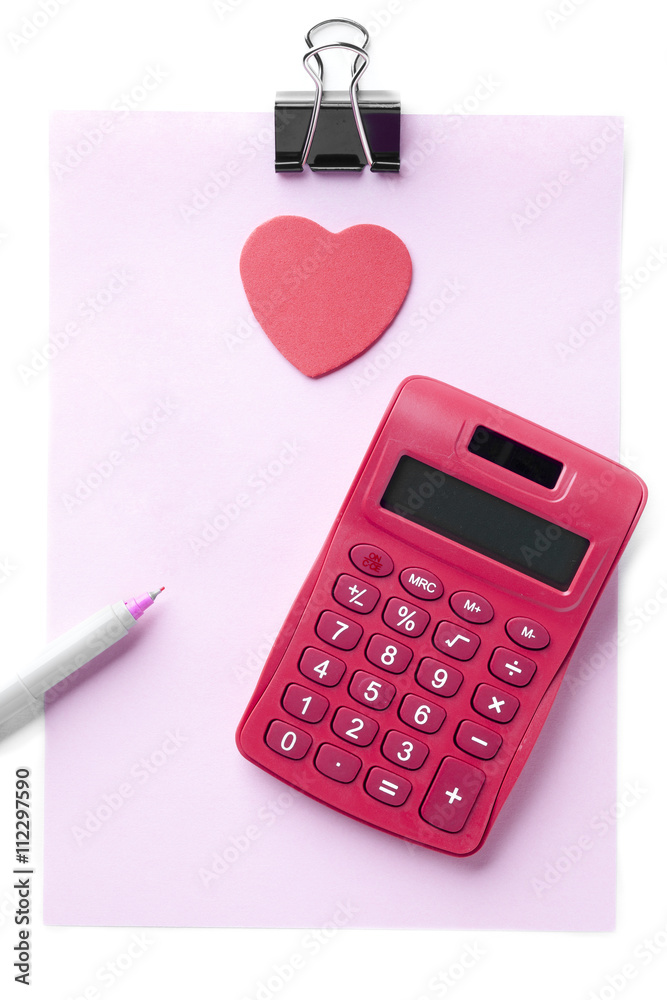 red calculator with clip, pencil and pink paper red calculator with clip, pencil and pink paper