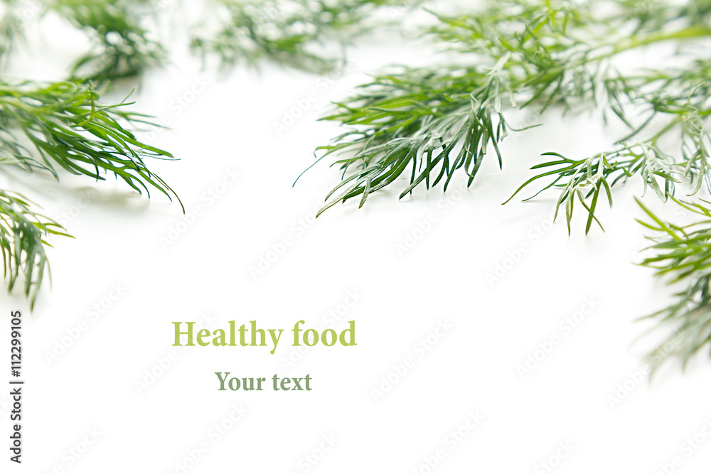 Fototapeta premium Sprigs of green dill on a white background. Frame with copy space for text. Isolated, studio, close-up