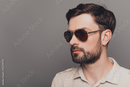 Portrait of brutal young bearded sexy man in spectacles