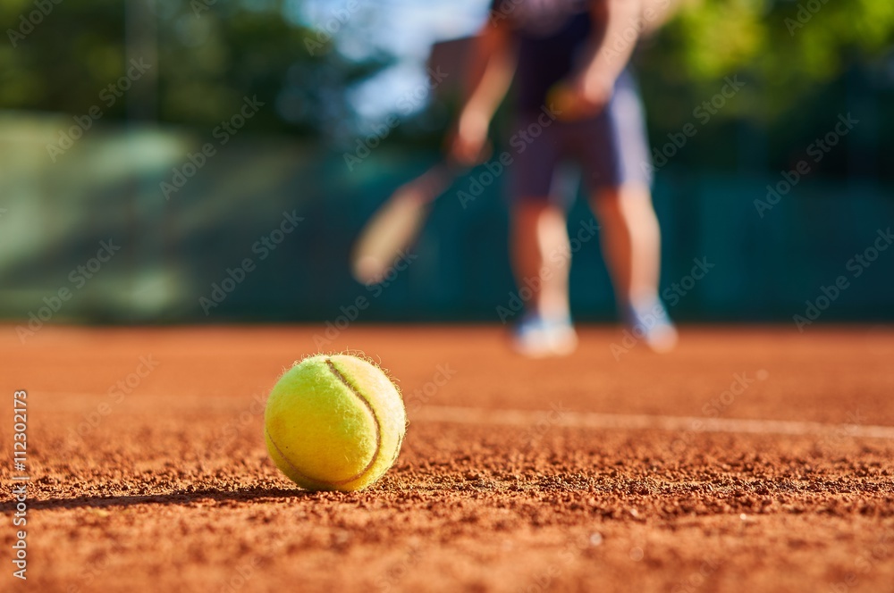 Tennis ball with blurred background.