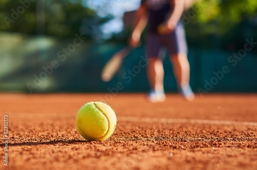 Tennis ball with blurred background.