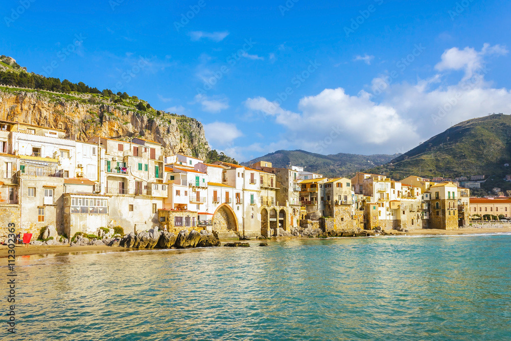 Cefalu beachfront with old building, Sicily, Italy