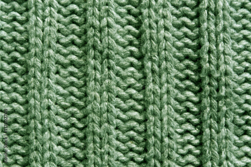Abstract green knitting texture close-up. Abstract green knitting texture close-up.