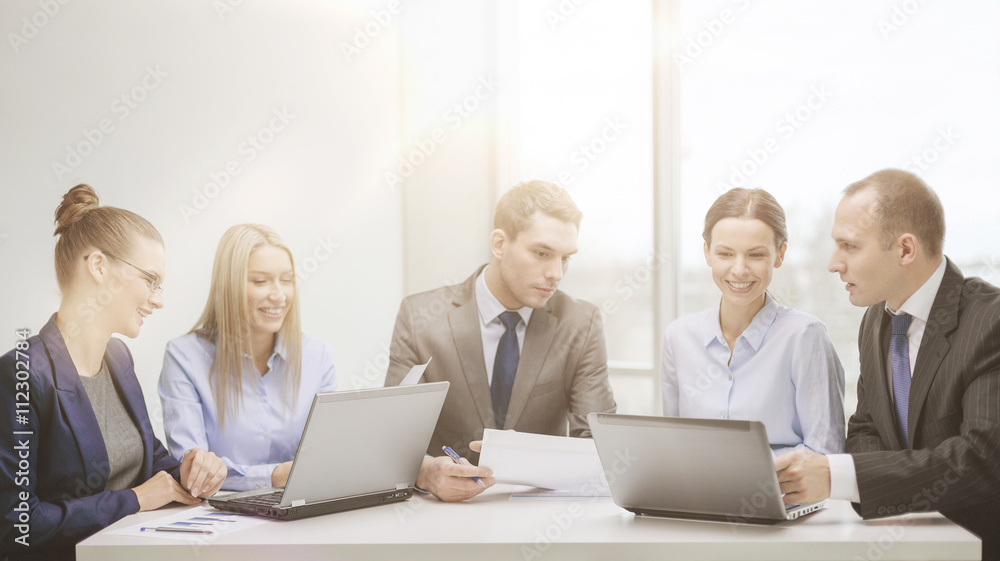 business team with laptop having discussion business team with laptop having discussion
