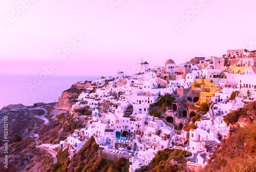 Santorini at sunset and purple sky, Mediterranean sea 