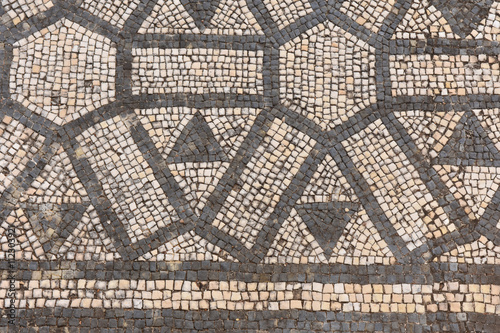 Geometric mosaic of the roman ruins of the ancient city of Conimbriga,Portugal photo