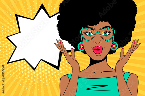 Wow pop art face. Sexy surprised african woman with open mouth, glasses in form of heart and speech bubble. Vector colorful background in pop art retro comic style.