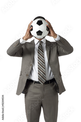 Fototapeta Naklejka Na Ścianę i Meble -  man hiding on a soccerball