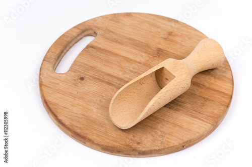 Wooden measuring scoops on the wooden kitchen board