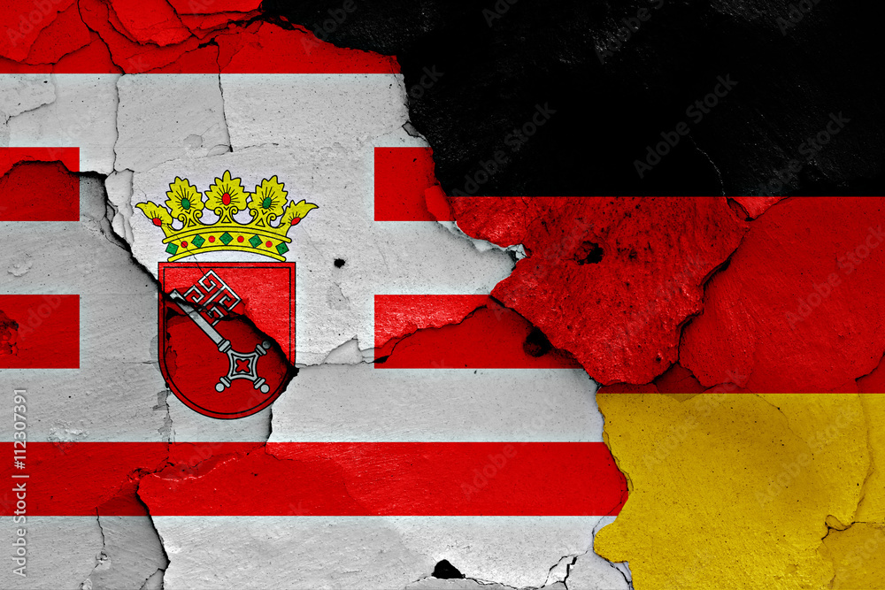 flags of Bremen and Germany painted on cracked wall