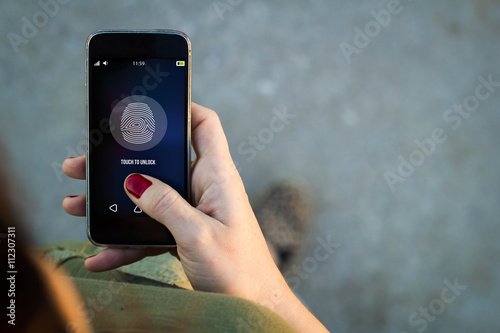 Woman walking smartphone fingerprint photo