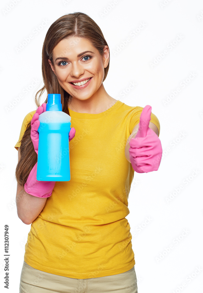 Thumb up housewife show holding cleanser. Bottle with copy spac Thumb up housewife show holding cleanser. Bottle with copy spac
