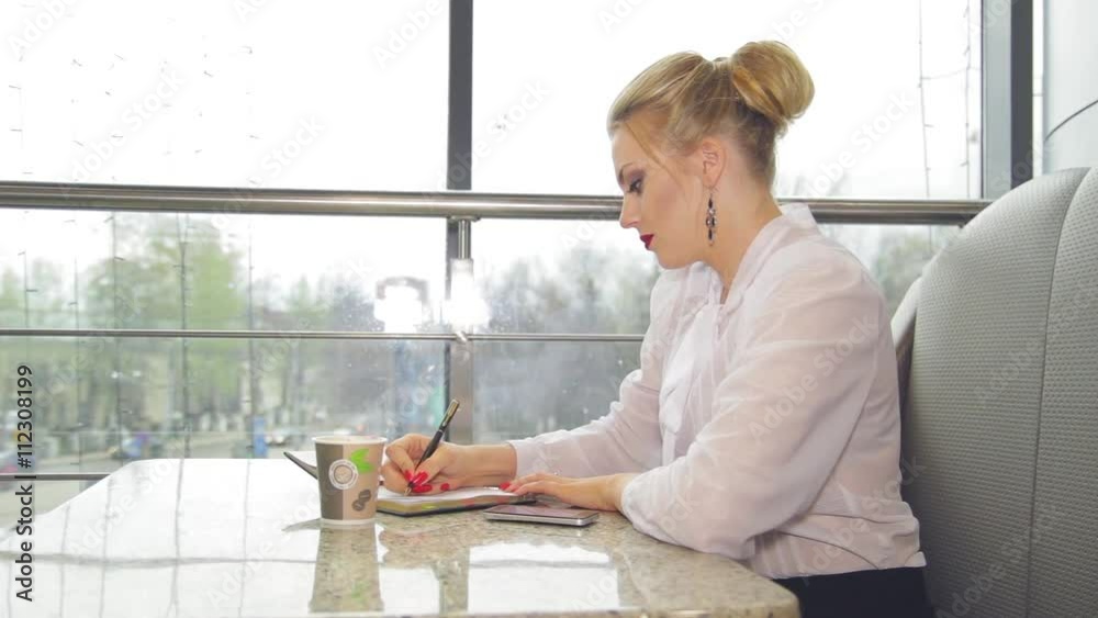 Businesswoman with smartphone drinking coffee Businesswoman with smartphone drinking coffee