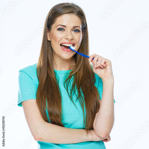 Toothy smiling beautiful woman with healthy teeth holding tooth