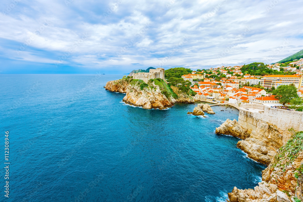 Old town Dubrovnik, buildings with orange roofs, Adriatic sea in Croatia